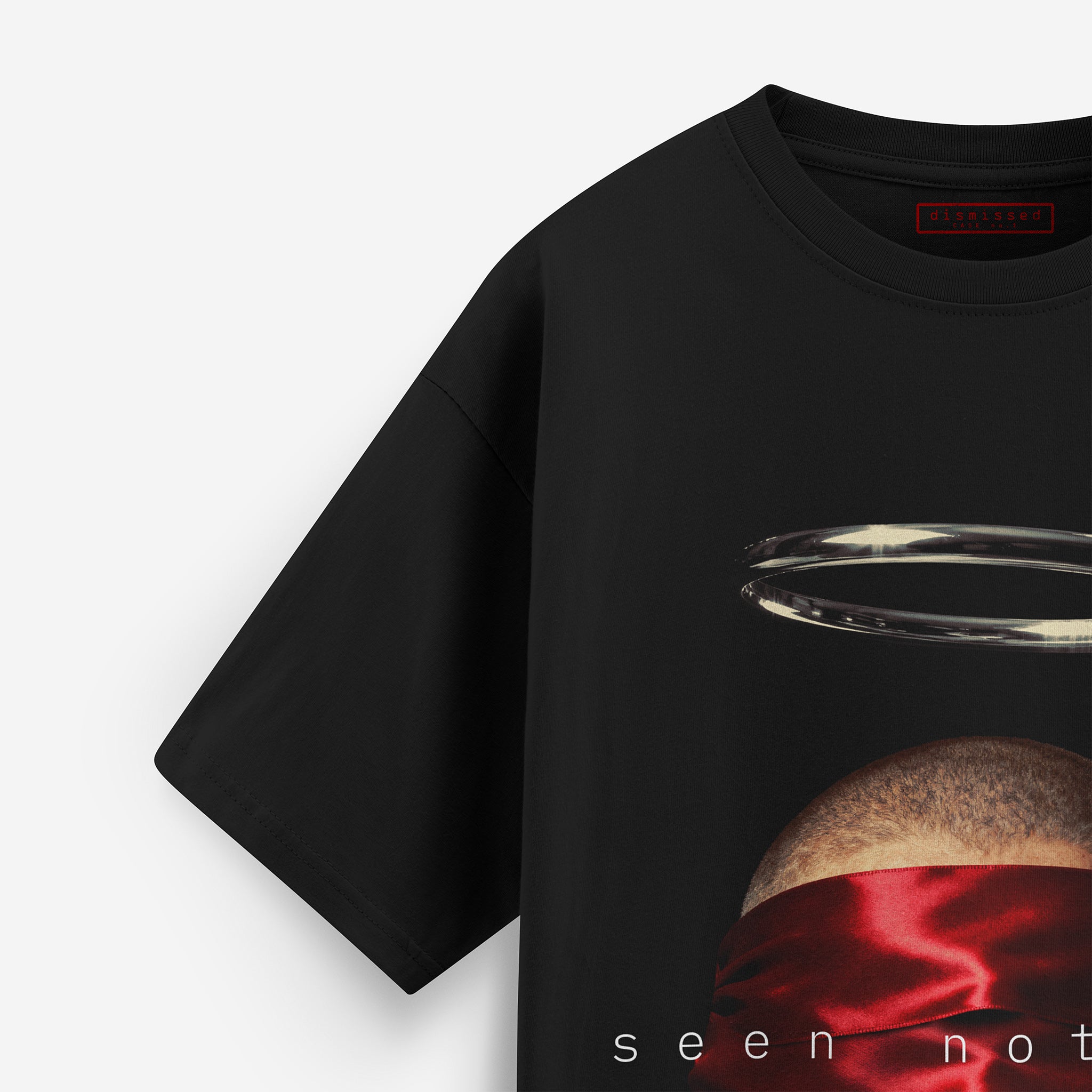Black t-shirt with a graphic design of a planet and red fabric, on a white background.