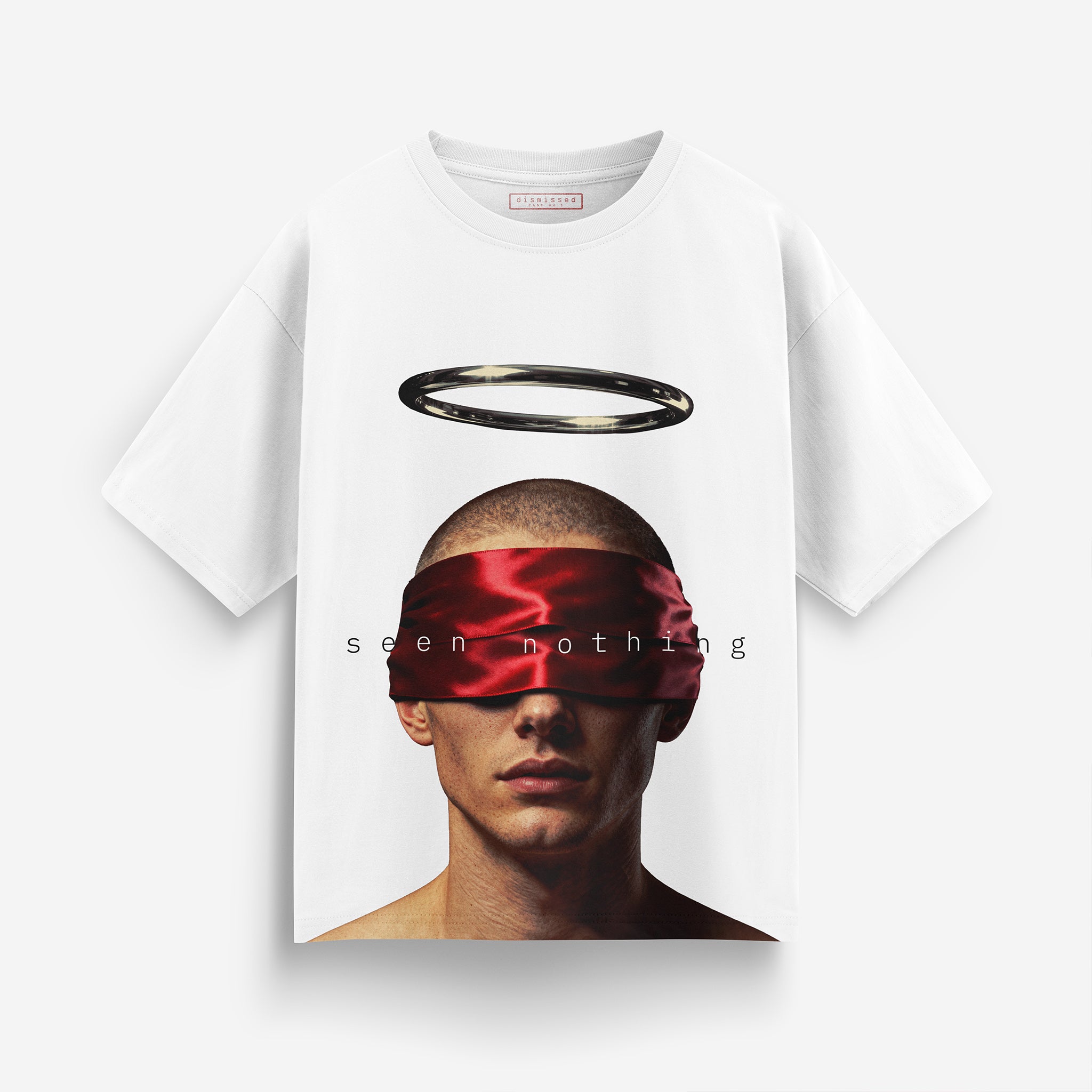 White t-shirt with a graphic of a person wearing a red blindfold and a halo, with text 'seen nothing'.